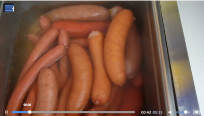 hot dogs in water at hot dog cart